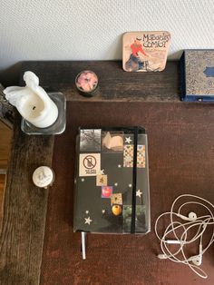 a wooden table topped with books and other items