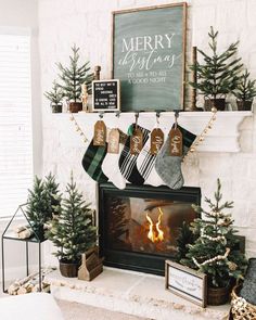 christmas stockings hanging from the fireplace mantle