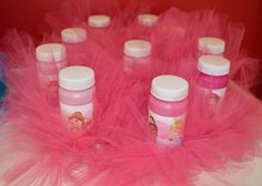 pink and white baby bottles with tulle around them