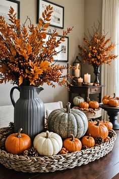 a basket filled with lots of pumpkins on top of a table