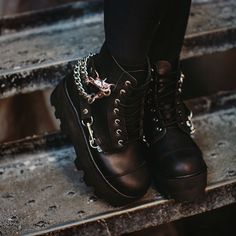 Normal is boring. Add some height to your day in these rad boots, featuring a cool, dino lug platform sole. Features a vegan friendly, black faux leather upper with a 7-eye lace-up closure. Has 4 removeable straps for some extra attitude. Has a sole height that is approximately 2 ¼” at the heel and 1 7/8” in the front. Has removable memory foam padding for added comfort. Creeper Boots, Flat Platform Sandals, Normal Is Boring, Lug Boots, Black Vegan, Platform Slippers, Leather Outfit, Black 7, Shoe Store