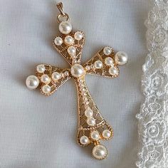 Beautiful Big Rhinestone Cross for Jewelry making or fashion accessory.  Sold as Cross Only (as pendant) CROSS Material: Gold Plated Alloy with Immitation Pearls Color: Gold and White Purpose: Pendants, Jewelry Making, Religious Gift, Fashion Accessory, Decoration, Cake Toppers, Arts and Crafts, Costumes  Size: Approximately 71mm wide, 101mm long, 7mm thick, Hole: 4mm Hand Made Cross Necklace, Big Cross Necklace, Pearls Fashion, Big Cross, Cross Jewelry Necklace, Decoration Cake, Necklace Cross, Rhinestone Cross, Gold Cross Necklace