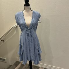 Nwt Adorable Summer Dress. Size Med. Light And Flowy Light Blue Knee-length Mini Dress For Beach, Light Blue V-neck Mini Dress For Casual Wear, Blue Mini Dress For Summer Daywear, Chic Light Blue Flowy Sundress, Light Blue Flowy Sundress Mini Dress, Light Blue Flowy Mini Sundress, Flowy Light Blue Mini Sundress, Blue Flowy Mini Dress For Daywear, Flowy Blue Mini Dress For Daywear