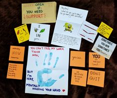 several handprints and sticky notes are arranged on a blanket