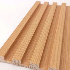 wooden planks are stacked on top of each other, with one piece cut out