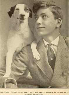 an old black and white photo of a man with a dog on his lap looking at the camera