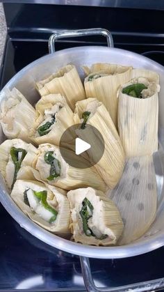 a pan filled with food sitting on top of a stove