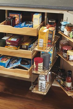 an organized spice rack in a kitchen with spices and condiments on the shelves