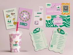 various stationery items displayed on pink surface with clippings and stickers to the side