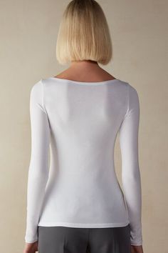 Long sleeve bateau neck top in soft micromodal. Softly hugs the body.
The model is 5’ 9” (175 cm) tall and is wearing a size S.

This garment is made of a plant-based fabric derived from sustainable and renewable wood sources. Boat Neck Tops, Bateau Neck, Lingerie Accessories, Lingerie Collection, Knitwear Women, Boat Neck, High Neck Dress, Long Sleeve Tops, Long Sleeve Blouse