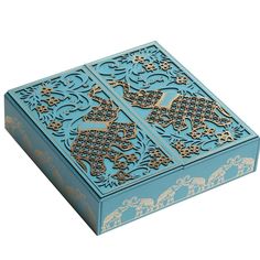 an intricately designed blue box with elephants on it