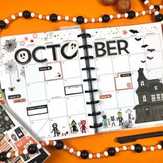 an october calendar is displayed on a table with beads and other things to do around it