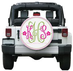 a white jeep with pink and green monogrammed letters