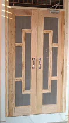 two wooden doors sitting next to each other