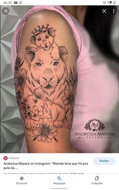 a woman's arm with a tiger and flowers on it