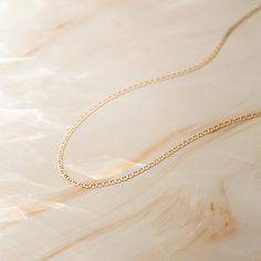 Our Dainty Mariner Chain Necklace is an absolute necessity for your jewelry collection. Its texture and shine add the perfect touch for every occasion. If you’re looking for a necklace to wear every day - this is it! It looks amazing on its own and even better paired with other layering necklaces. Made of 14k solid gold, this necklace is sure to keep its shine and never trouble you with tarnishing or irritation. Get ready for compliments - you're going to love how you look & feel in your Dainty Rose Gold Cable Chain Necklace For Everyday Luxury, Timeless 14k Rose Gold Chain Necklace, Rose Gold Cable Chain Necklace In 14k Gold Filled, 14k Rose Gold Filled Necklaces With Cable Chain, Delicate Chain 14k White Gold Necklace, Timeless Delicate Chain Necklace In Rose Gold, 14k Rose Gold Filled Necklace With Cable Chain, Fine Jewelry Necklaces With Delicate Oval Link Chain, Fine Jewelry Necklace With Delicate Oval Link Chain