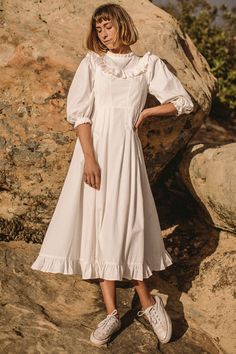 Taking a cue from vintage patterns, our take on the prairie dress is a study of softness and structure. Pretty details--a ruffled collar and yoke, large puff sleeves that hit at three-quarter length, and a bow that ties in the back—sit in perfect accord with a fitted bodice and flattering panels, all capped off with a Prairie Dress Pattern, Kara Thoms, Praire Dresses, Prarie Dress, Prairie Dresses, Vintage Prairie Dress, Cottagecore Style, Prairie Style, Fashion Now