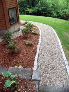 a gravel path in front of a house