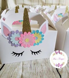 some little boxes with unicorn ears and flowers on them