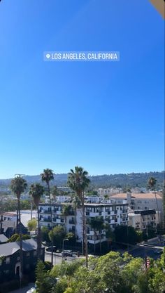 the view from an apartment building in los angeles, california with palm trees and buildings