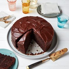 a chocolate cake with one slice missing from it