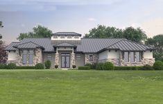 a large house in the middle of a grassy field