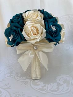 a bridal bouquet with blue and white flowers