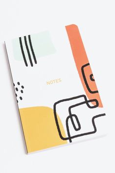 a notebook with an abstract design on the front and back cover that says notes in gold