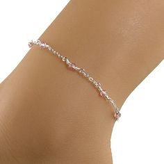 Pretty in pink anklet made with small 4mm Swarovski crystals, soft pink in color, and sterling silver chain.  The anklet has a sterling silver lobster clasp.  Lovely, understated, and dainty ankle bracelet. Available in many sizes.  Please choose the size that you need from the drop-down menu, bearing in mind that the anklet size you order should be approximately one inch larger than the size of your ankle.  The anklet will arrive in an attractive gift box. Cheap Pink Round Bead Anklets, Elegant Adjustable Pink Anklets, Elegant Pink Adjustable Anklets, Pink Anklet, Dainty Anklet, Teardrop Pearl Earrings, Cloisonne Jewelry, Crystal Anklet, Silver Anklet