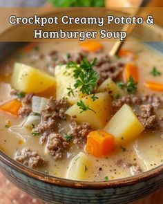 a close up of a bowl of soup with meat and potatoes