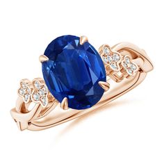 an oval blue sapphire and diamond ring in rose gold with diamonds on the band,