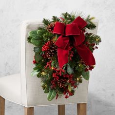 a christmas wreath sitting on top of a chair