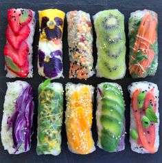 sushi rolls with different types of fruits and vegetables on them are arranged in a grid