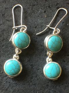 Real Turquoise,set in pure  silver bezel, good size gemstone 12mm diameter,stamped 925 ,nice weight and generous medium earwires but not to thick  0.9 gauge. only making one pair, will probley make a braclet as well to go with Earings, time will tell,interesting surface of Earings not actual cracks,smooth service,these gemstones are not currently in outlets,making them rare and not  produced in any number  also available to order with post and scroll attachements. .  .thank you for viewing only available on Etsy. Turquoise Round Sterling Silver Earrings, Real Turquoise Jewelry, Time Will Tell, American Indian Jewelry, Real Turquoise, Dream Jewelry, Turquoise Jewelry, Pure Silver, Indian Jewelry