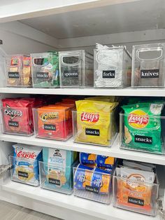 the shelves are filled with many different types of food and storage bins on them