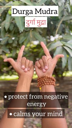 two hands with bracelets on their wrists and the words duga mudra written in english