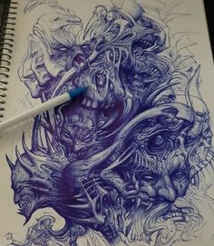 a drawing on paper with a marker in it's mouth and an image of monsters