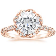 a rose cut diamond engagement ring set in 18k rose gold with diamonds on the band