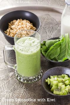 green smoothie with kiwi, spinach and cashews on the side