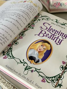 an open book with the title sleeping beauty on it