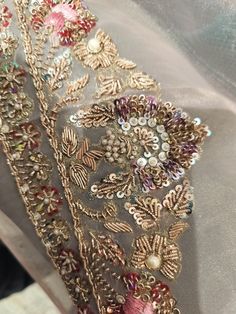 a piece of cloth covered in sequins and beads