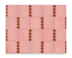 a pink and brown tile with circles on it