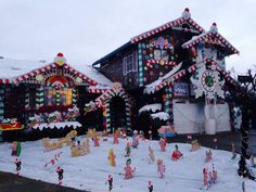 a house covered in christmas decorations and candy canes