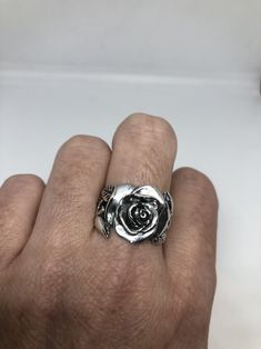 Lovely and delicate Rose flower ring 925 Sterling silver with black rhodium Size 8 or 8.75 can be re sized for you on request. My jeweler charges $10 All rings are shipped in a nice gift box. Check out our over a THOUSAND great reviews Engraving is $4 per letter and is not always perfect depending on the piece. It can take a few days if the jeweler is busy. This is payable to Paypal Judithsltd@gmail.com Elegant Silver Rings With Rose Details, Silver Rose Design Ring, Silver Rose Ring Jewelry, Silver Ring With Rose Design, Rose Design Open Ring Jewelry Gift, Sterling Silver Rose Flower Ring With Rose Design, Silver Flower Ring With Rose Design, Adjustable Sterling Silver Flower Ring With Rose Design, Silver Flower Ring With Roses For Anniversary