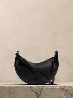 A hobo bag interpretation of our best-selling Vida bag, this half-moon silhouette is cut from Italian, pebbled leather which lends this style a softness and slouchy quality we love for its at-ease elegance.  Plus, we made sure its large enough to accommodate even the largest sized phones and ensured the strap is adjustable so you can wear on your shoulder or as a crossbody bag.  Zip top closure.  Interior card slot.  Adjustable shoulder strap.  Height: 6. 5" Width: 11" Depth: 3" Moon Silhouette, Outfits Ideas, Zip Top, Half Moon, Fall Vibes, Hobo Bag, Pebbled Leather, Women's Accessories, Crossbody Bag