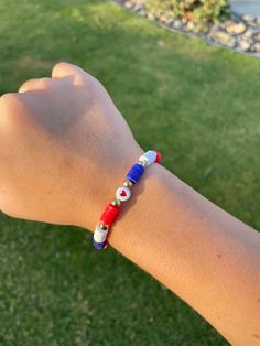 This is a red, white, and blue clay bead bracelet. Made for 4th of July and or Memorial Day if you would like. But for the most part those types of holidays. 4th July Braclets, Clay Bead Bracelet Ideas Red White And Blue, Spider Man Bracelet Clay Beads, Bracelet Patterns Clay Beads Summer, Blue And Red Bracelet, Usa Beaded Bracelet, 4th Of July Bracelet Patterns, Buffalo Bills Clay Bead Bracelet, Clay Bead Bracelet Ideas Spiderman