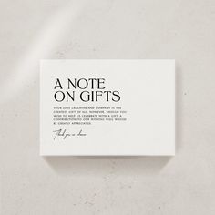 a note on gifts written in cursive font and surrounded by black ink, against a white background