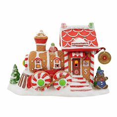 a gingerbread house is decorated with candy canes