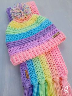 a multicolored crocheted hat and scarf