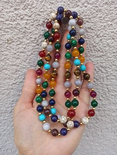 material: Color natural stone Made of natural stones, this necklace consists of all kinds of natural stones. It will give you positive energy and healing. It will look great on your neck. Please feel free to send me a message about the product and I will reply you immediately. https://www.etsy.com/shop/Hirajewelrydesign?ref=seller-platform-mcnav Multicolor Necklaces With 108 Beads For Meditation, Multicolor Handmade Spiritual Mala, Handmade Multicolor Spiritual Mala, Handmade Multicolor Bohemian Mala, Bohemian Multicolor Handmade Mala, Long Beaded Necklaces With Natural Stones For Gifts, Multicolor 108 Beads Mala As Gift, Multicolor Mala With 8mm Beads, Handmade Multicolor Healing Mala